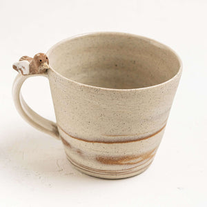 These calming designs were inspired by a camping trip in the Australian bush.  Each piece is one of a kind made on the potter’s wheel allowing the different clays to mix together and create marbled patterns.   These mugs also come with a resting bird on the handle thoughtfully designed so that your thumb rests comfortably on the back of the bird.